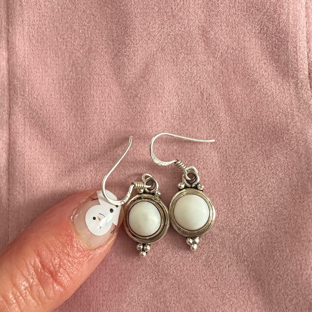 Sterling Silver dangle earrings with white stone center
